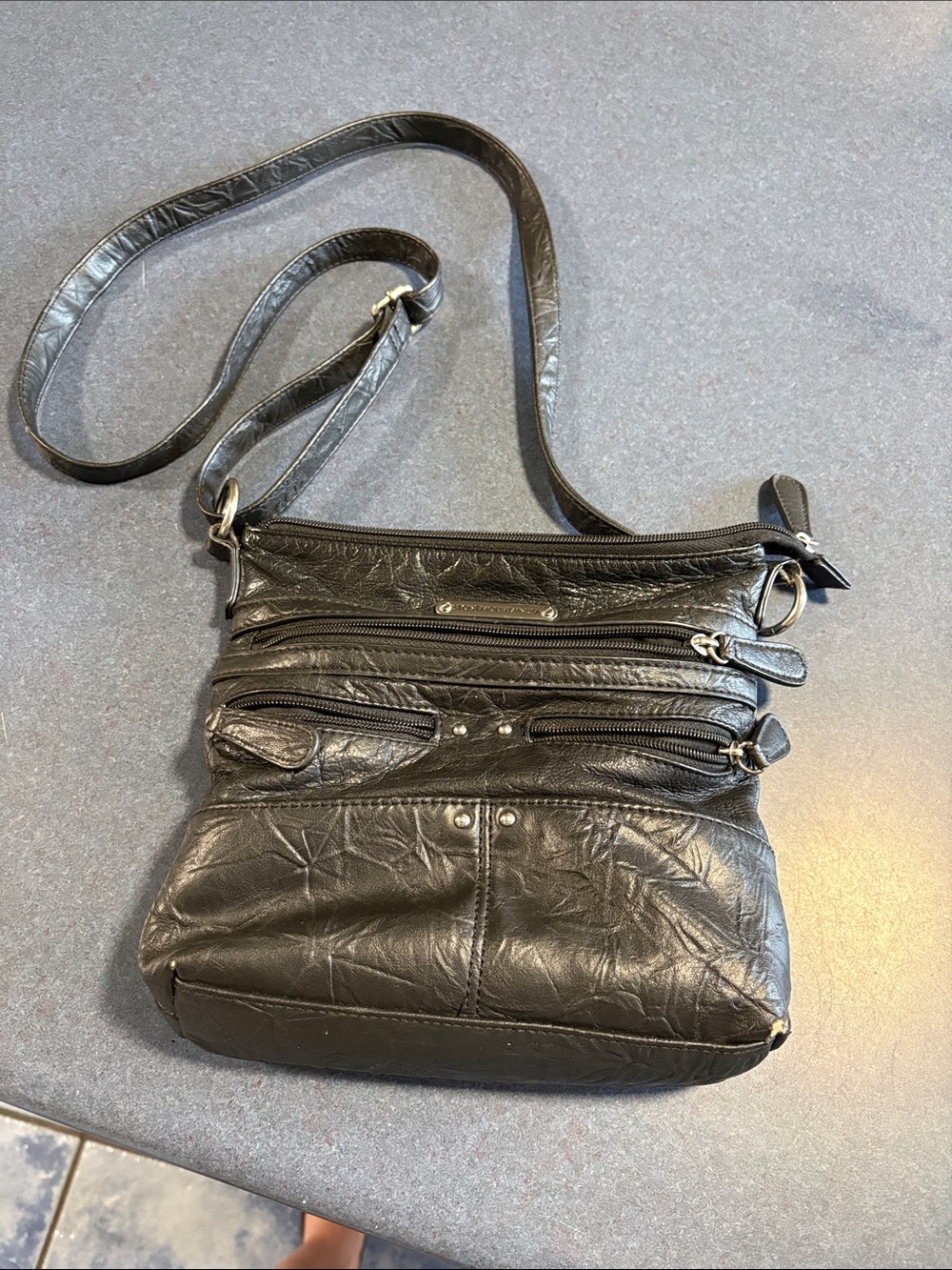 Black Leather Crossbody Bag with Multiple Zip Pockets
